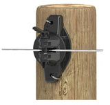 Gallagher Black electric fence insulator  attached to a wooden post with a white background