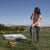 Gallagher chicken fencing being erected to protect laying chicken with woman farmer installing it