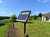 Farm view of a Gallagher S100 Solar electric fence Charger on a fence post