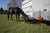 Horse in portable Gallagher Smartfence corral nest to trailer